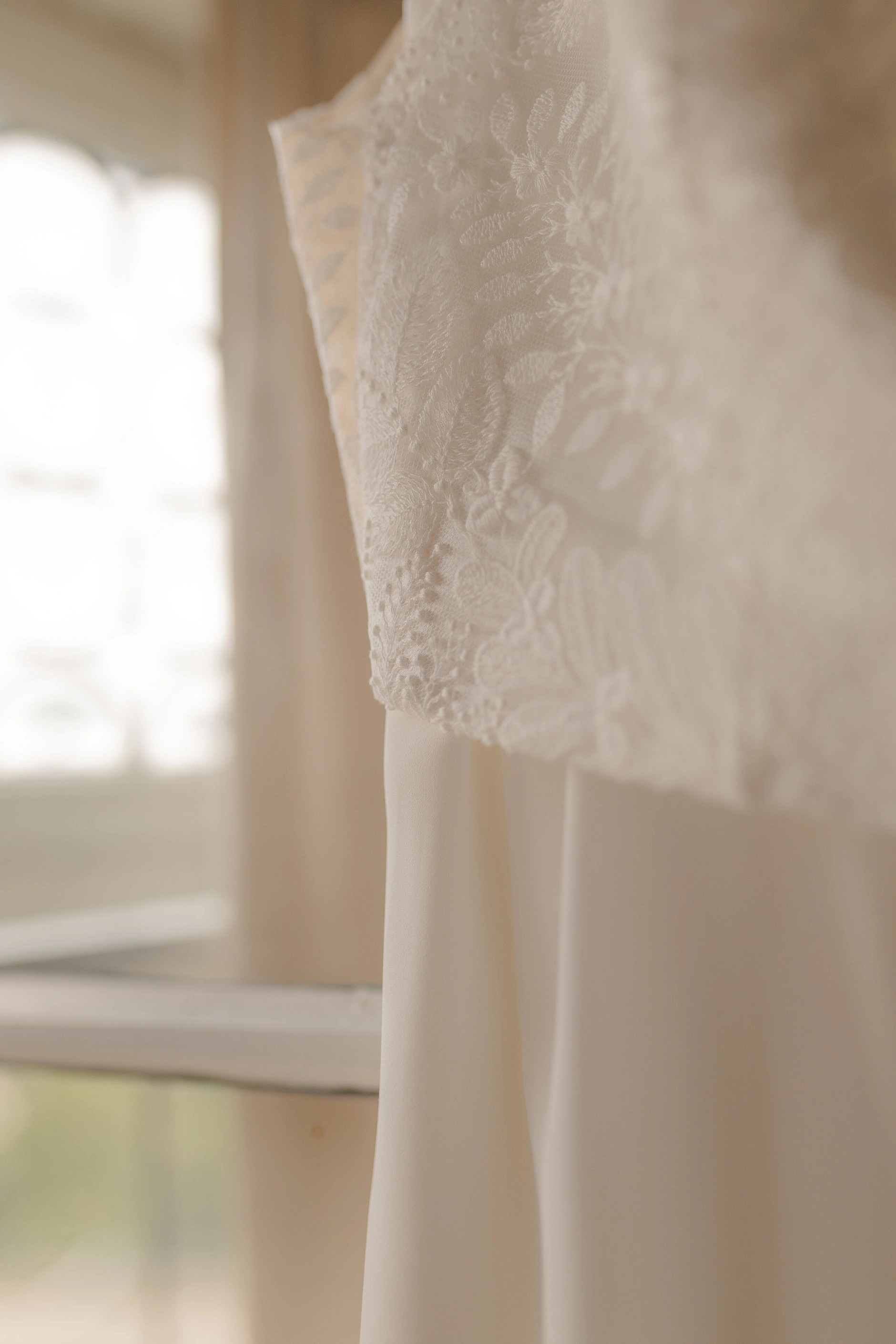 Wedding rings on lace fabric – detail shot, Selina and Manuel at Burg Abenberg castle Bavaria